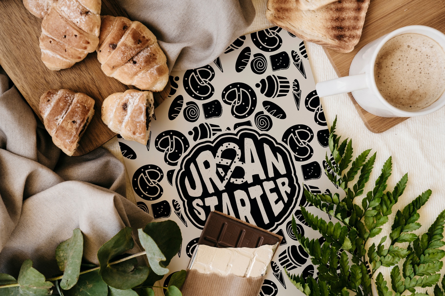 Urban Starter — bakery flat lay with pastries, coffee and hand-drawn illustrations.